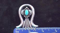 Intricate, antiqued sterling silver Naja style broach with Arizona turquoise cab