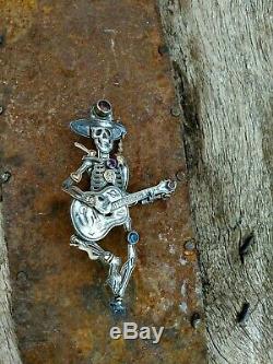 Kit Carson Skeleton Musician. Sterling silver + semi precious. Pendant/pin