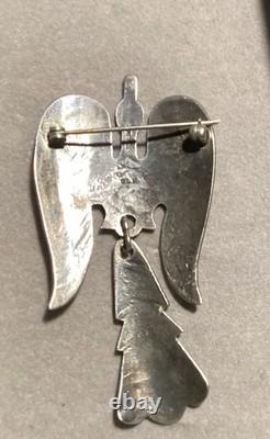 Sterling silver Thunderbird pendant/brooch with turquoise and red stone inlay